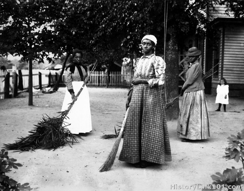 Black woman with brooms of Bambusa