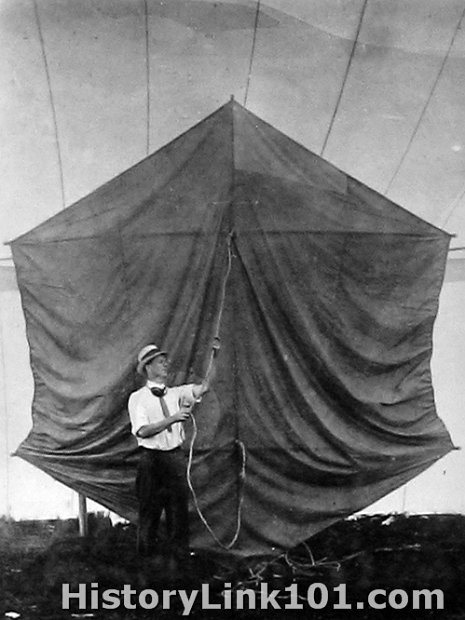 Man Lifting Kite