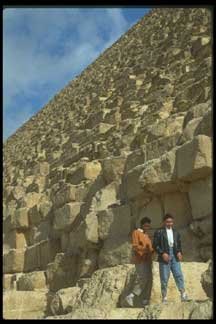 pyramid with people besides