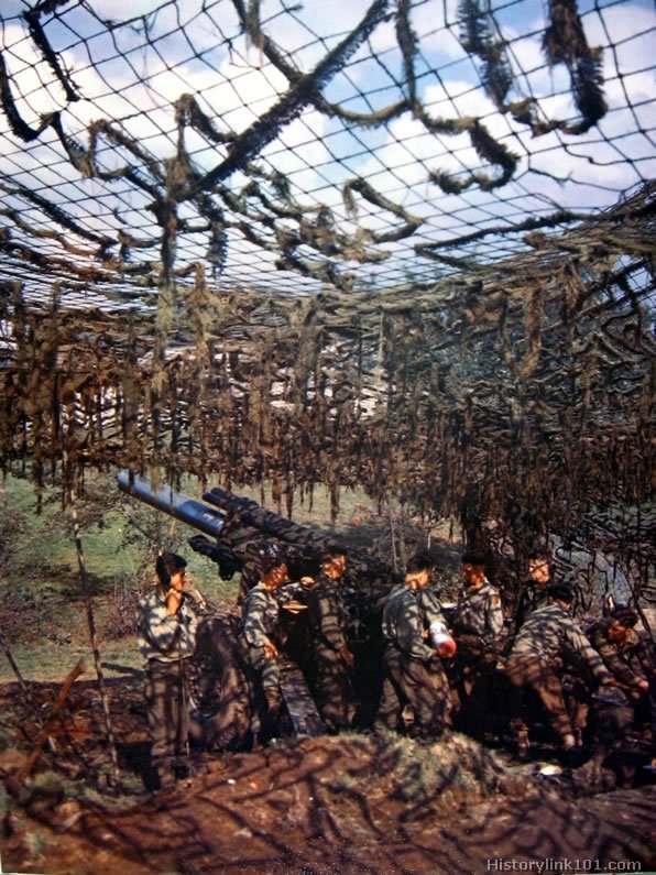 Royalty Free Pictures of A 155mm Howitzer gun in action against the Germans near the Siegfried Line.  Germany, 1944
