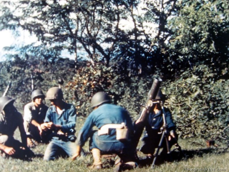 Royalty Free Pictures of 185th Infantry firing 81 mm mortars, Camp Chorrera.  December, 1942
