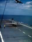 Plane taking off of  USS Charger