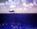 Plane over the deck of the USS Essex